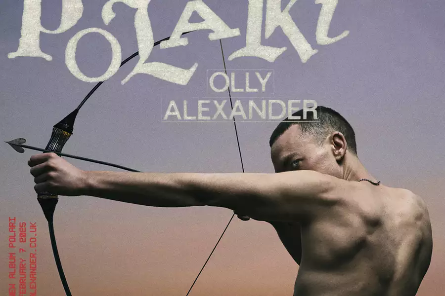 A promotional poster for an album titled "POLARI" by Olly Alexander. The design features Olly Alexander from the back, shirtless, holding a drawn bow with an arrow aimed forward, signifying focus and intensity. The background is a gradient sky transitioning from dark purple to a soft, warm sunset hue. The album's title "POLARI" is displayed in bold, textured lettering at the top, while "OLLY ALEXANDER" is written below in smaller, uppercase letters. On the left side, in red text, it mentions the album's release date as February 9, 2025. The Polydor Records logo is visible in the bottom-right corner.