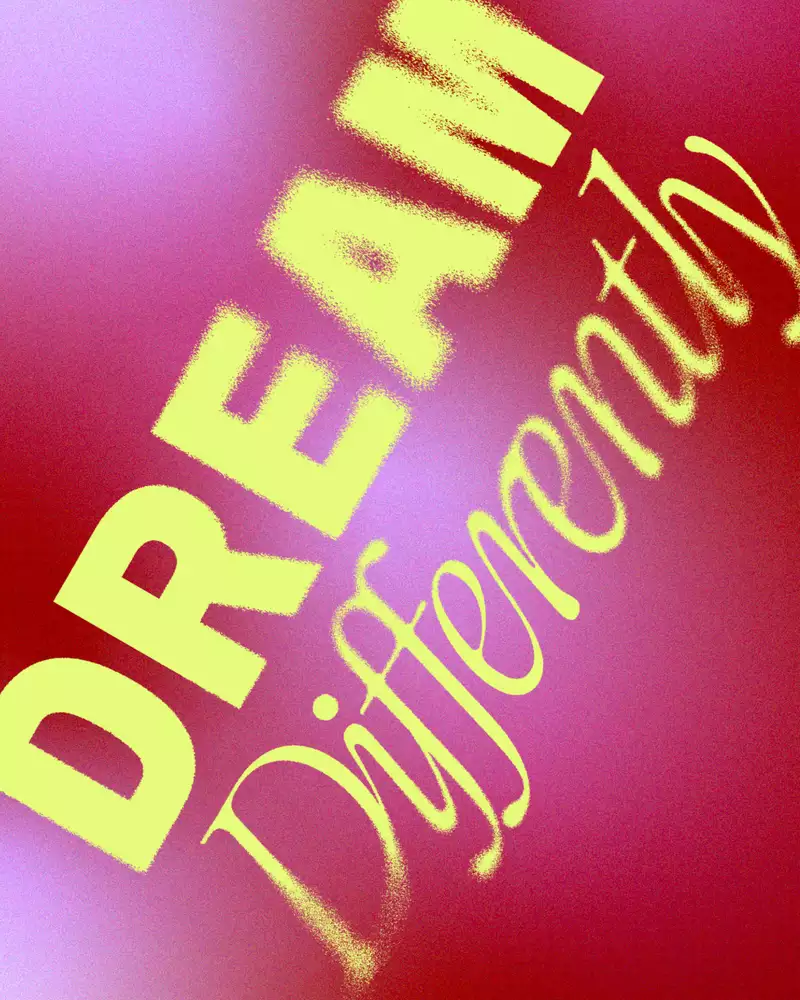 A bold, artistic graphic with the words "DREAM Differently" in yellow text against a red and pink gradient background with a grainy texture.