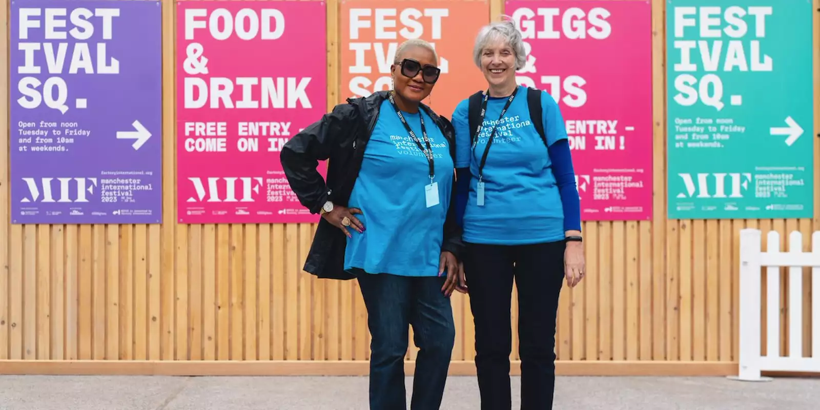 Photo of two volunteers on Festival Square
