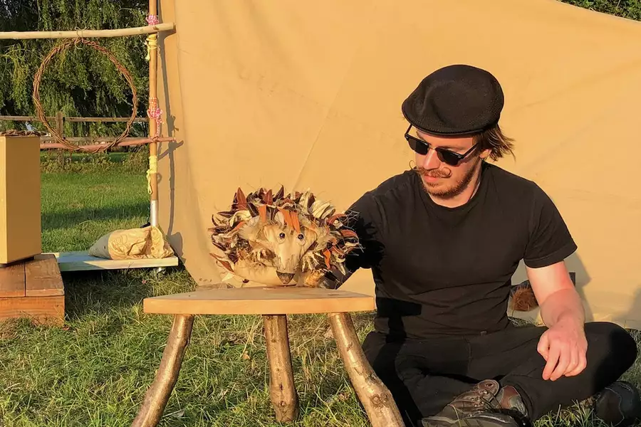 Photo of a person performing with a hedgehog puppet