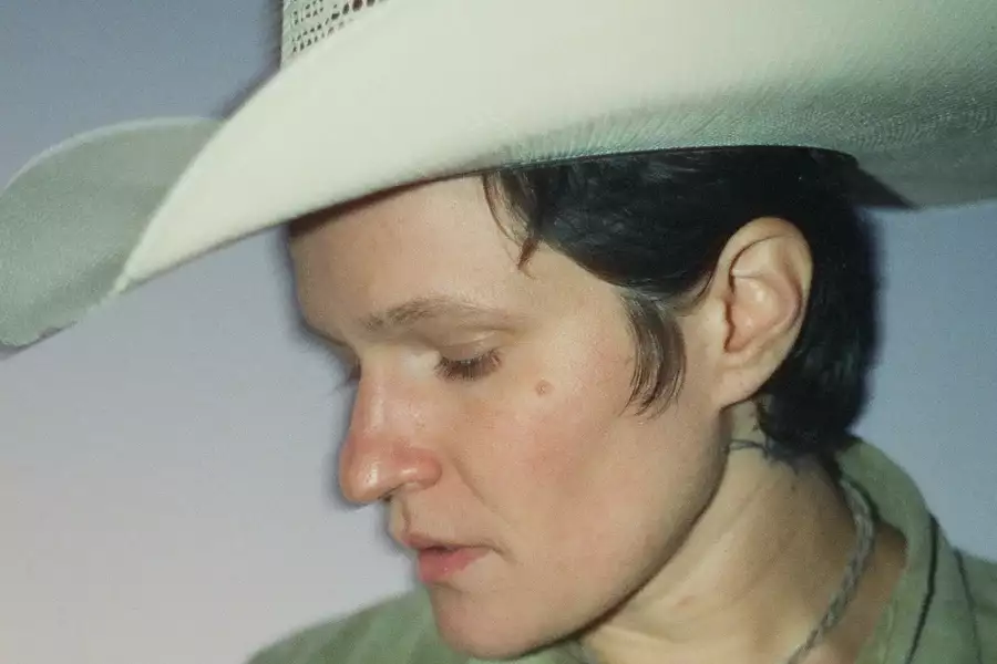 Adrianne Lenker wearing a white hat