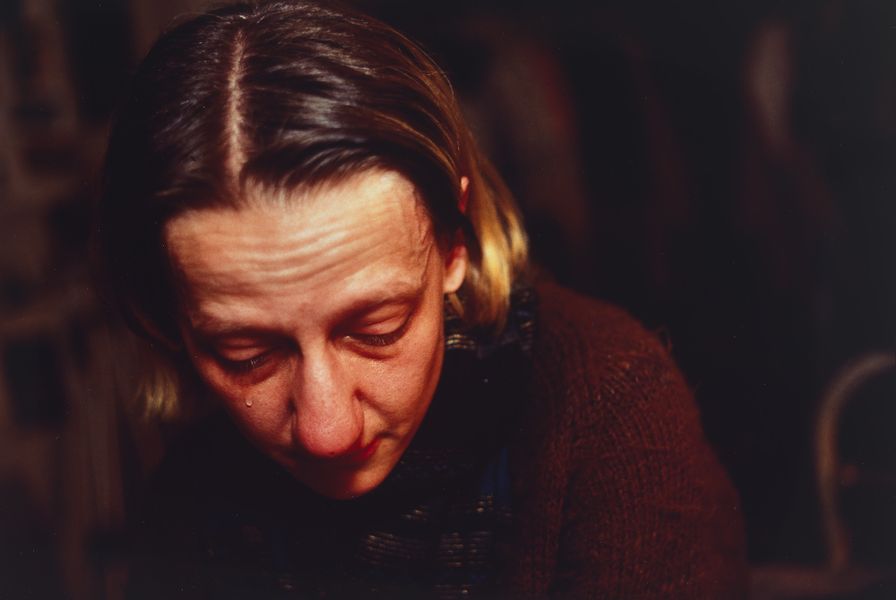 Cibachrome colour photograph of a woman up close to the camera crying
