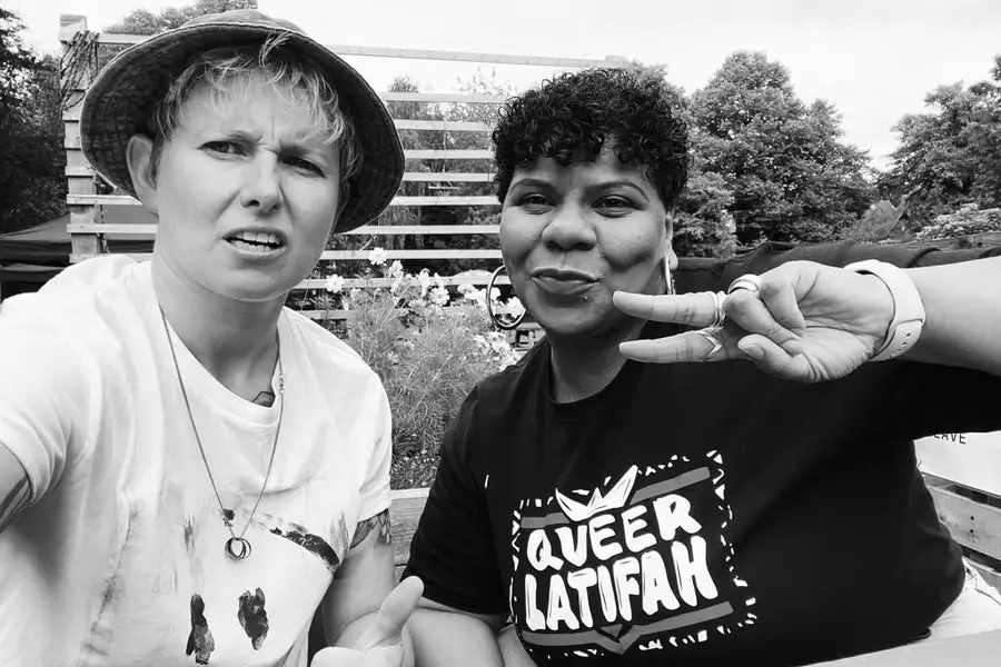 Black and white photo of two DJs for Queer Latifah