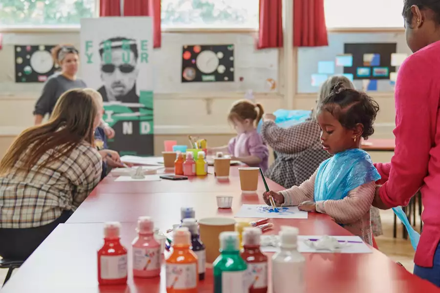Photo of families painting together
