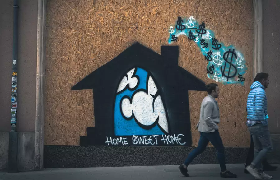 Photo of graffiti that reads Home Sweet Home in front of a house and clouds