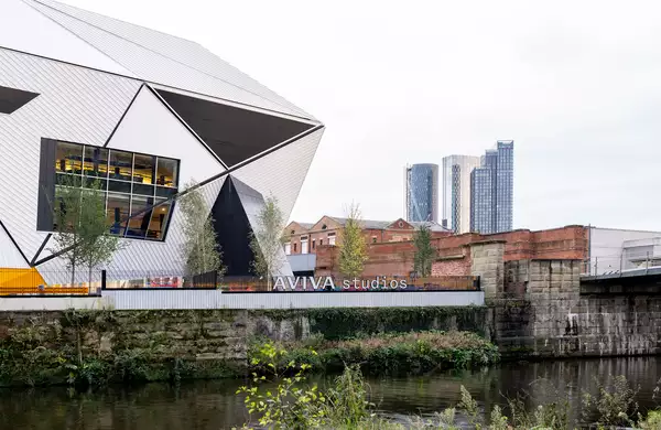 Photo of the exterior of Aviva Studios from across the river