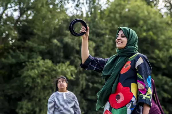 A lady flying a kite