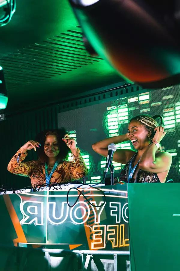 Photo of two DJs at the decks