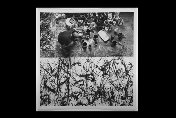 Video still of artist dipping paint brush into paint tin.