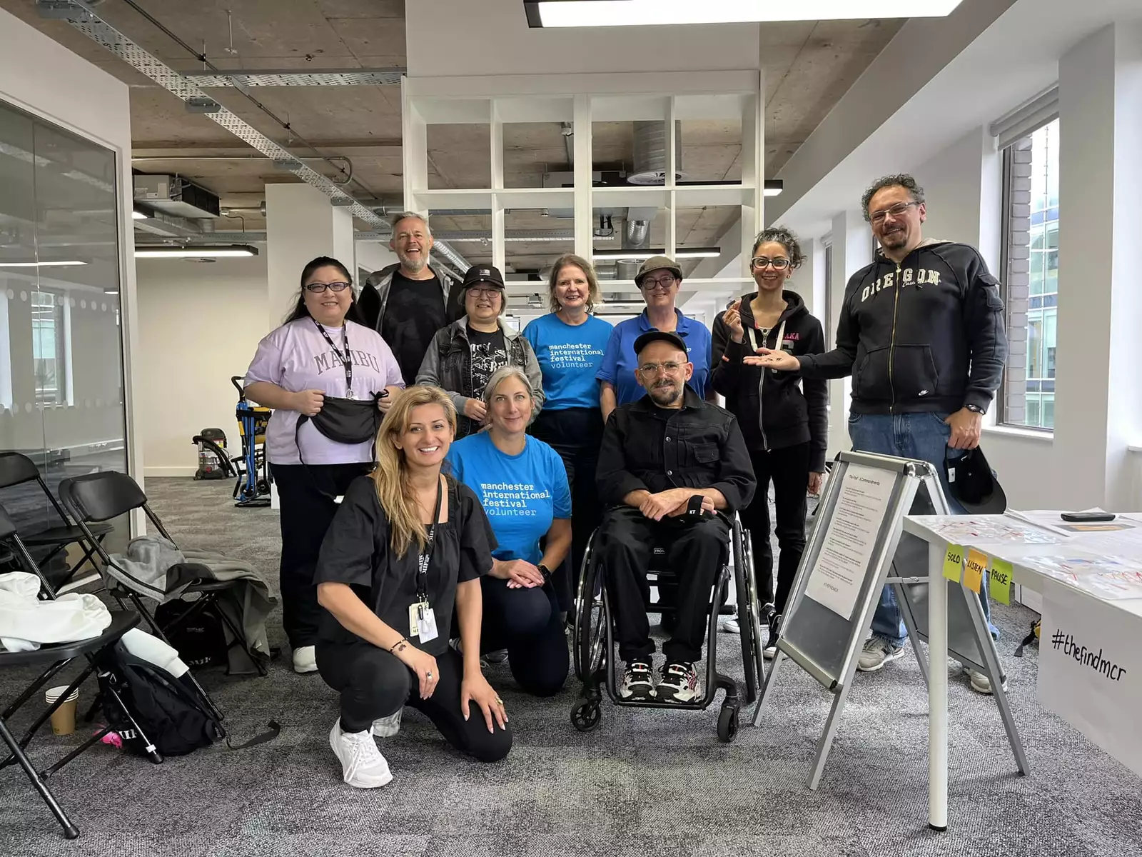 A group of volunteers with Ryan Gander