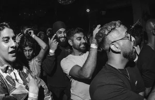 Black and White photo of group of people at a concert event