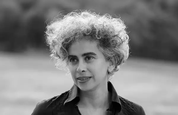 Black and white headshot of Adania Shibli smiling