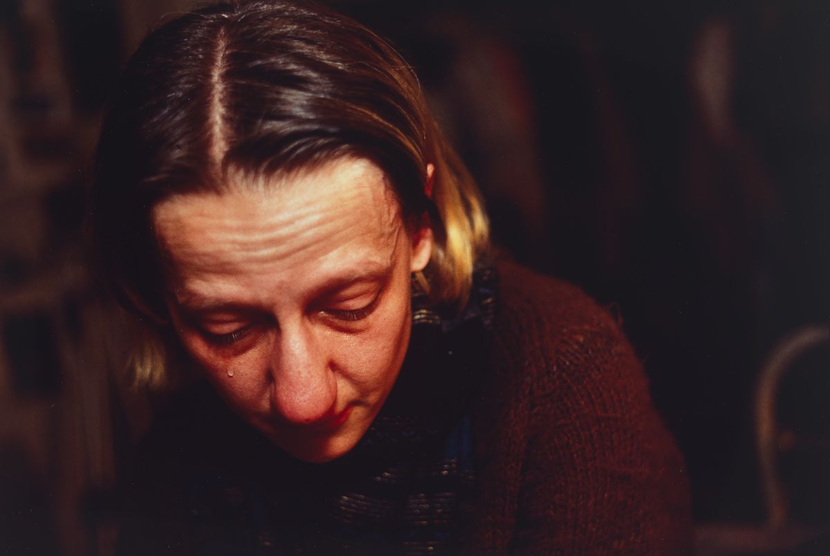 Cibachrome colour photograph of a woman up close to the camera crying