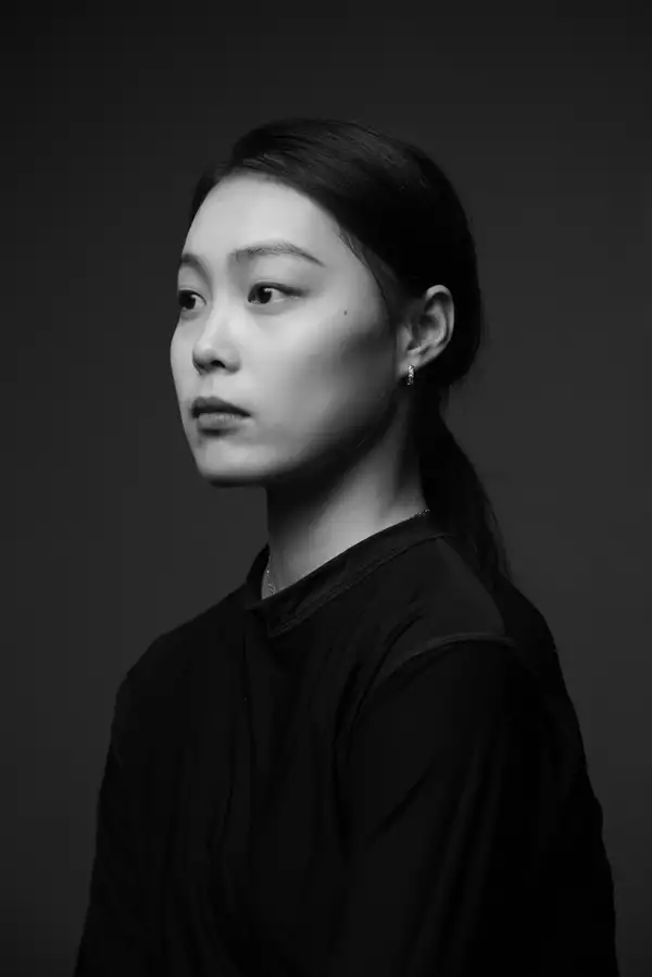 Black and white headshot of Haiqing HU