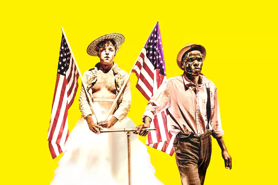 Two people holding two American flags on a yellow background