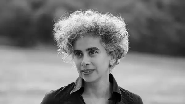 Black and white headshot of Adania Shibli smiling