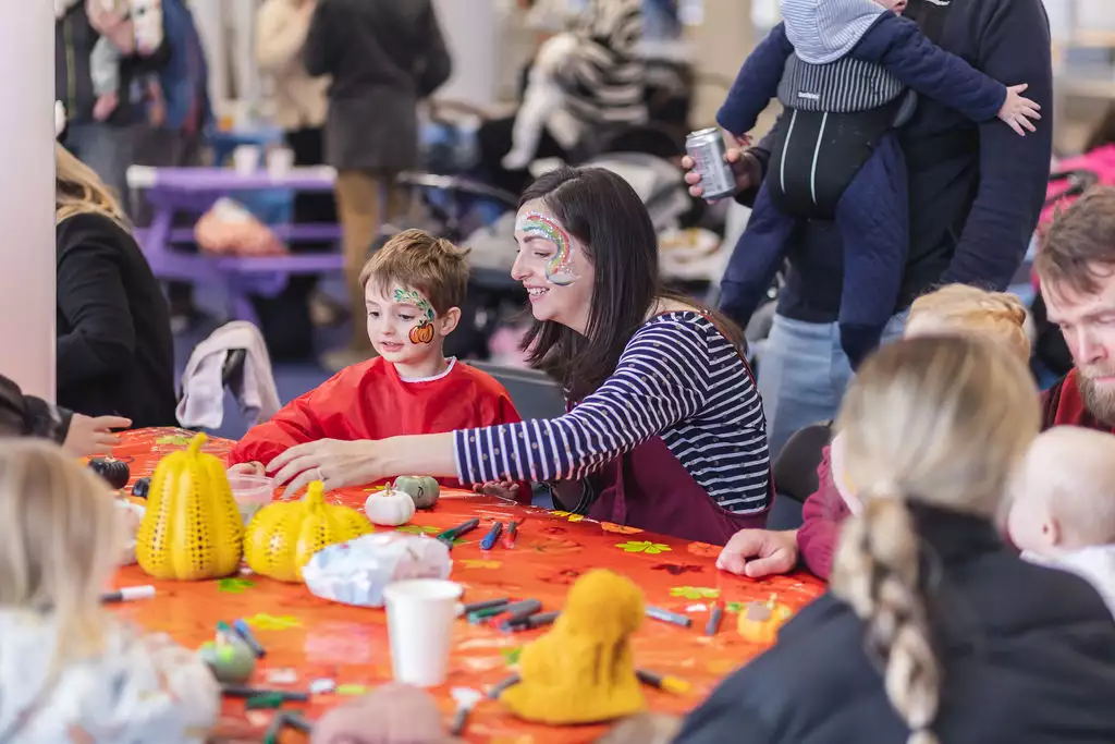 First breath families at a craft session with face paint on
