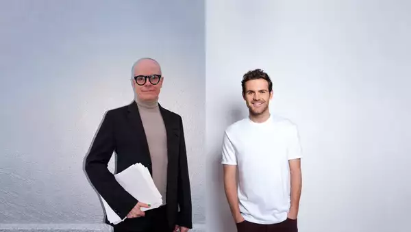 Hans Ulrich Obrist and Juan Mata in front of a white background