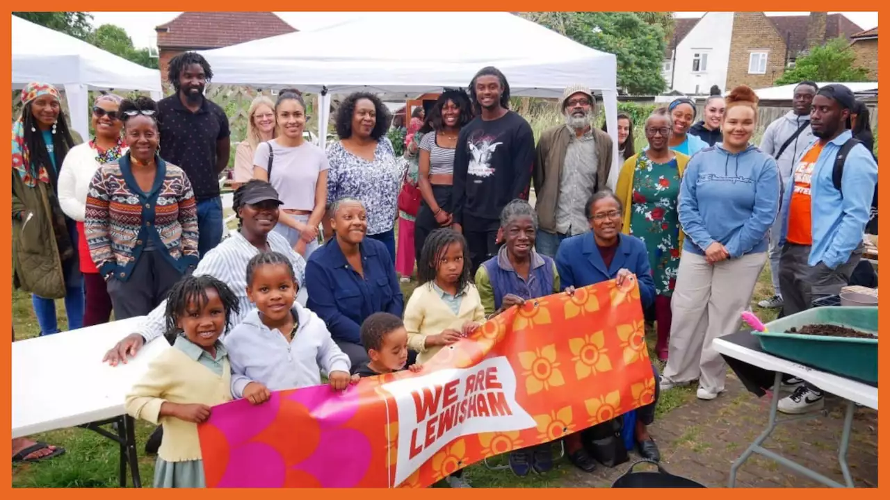 Photo of a community group holding a banner that reads 'We Are Lewisham'