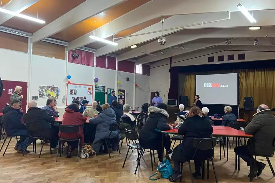 Photo of people gathering at a film screening by ReelMCR
