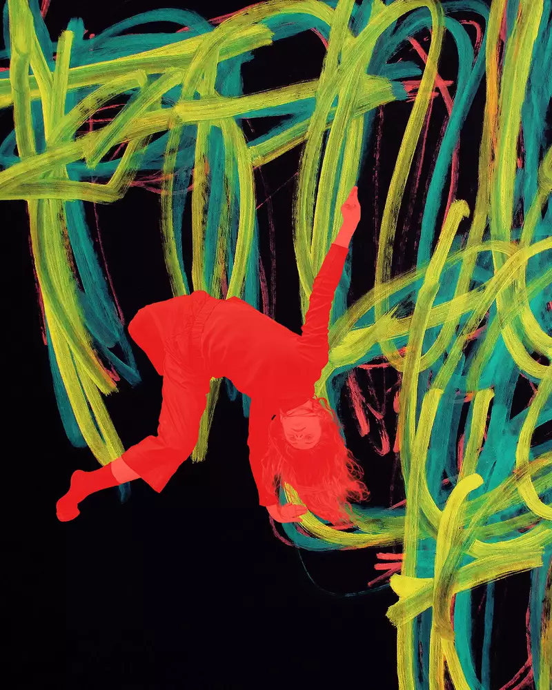 A painting by Michael Beard showing yellow, red and blue lines on a black background. There is a red image of a dancer upside down overlayed on the painting.