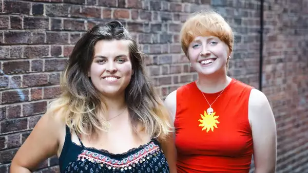 Duo Watson & Lockett posing for a photo smiling