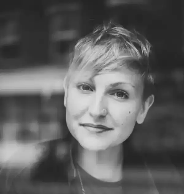 A black and white headshot of producer Hattie Gregory