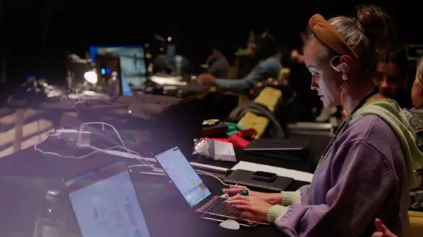 Writer Sabrina Mahfouz works on her laptop