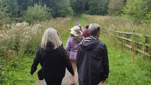 Photo of people on a walk through nature