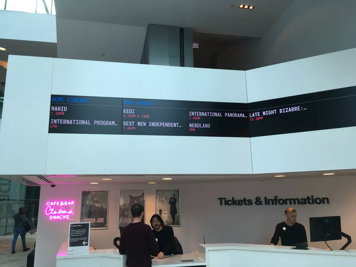 Picture of the ACMI box office, showing the cinema times