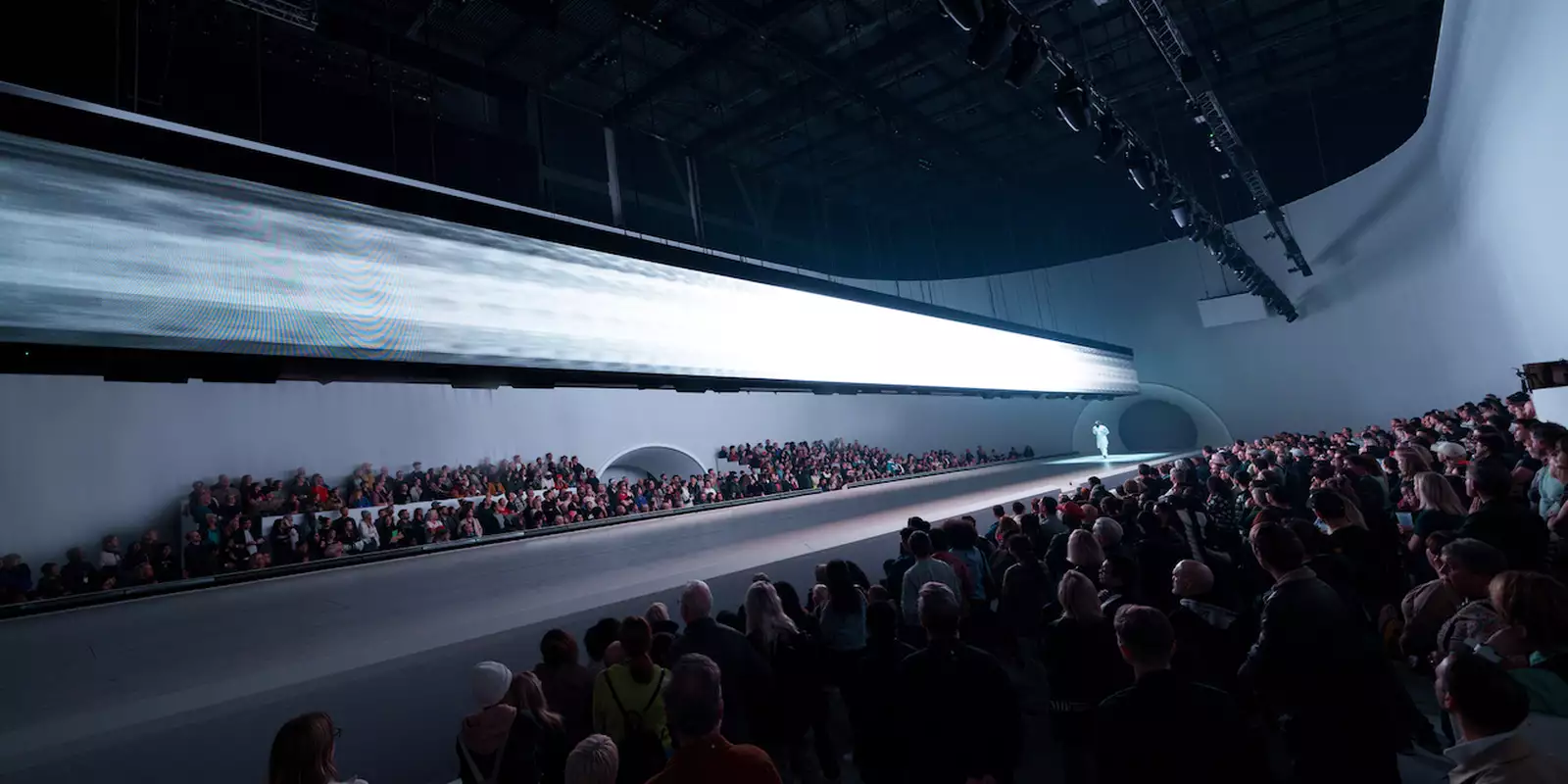 The audience watching the Free Your Mind stage lit up with white lighting