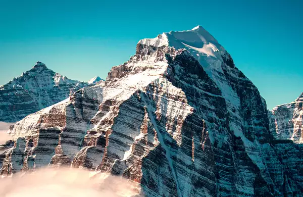 A picture of mountains against a blue sky