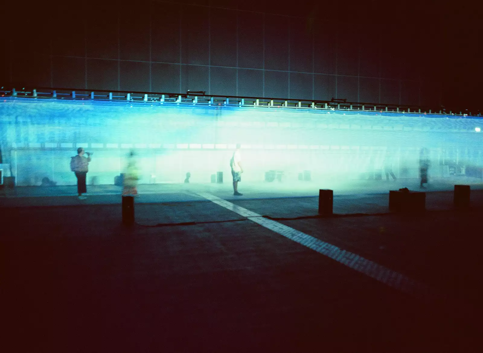 Part of 54: Manchester's installation in the Warehouse, showing a fabric walkway with films projected on to it.