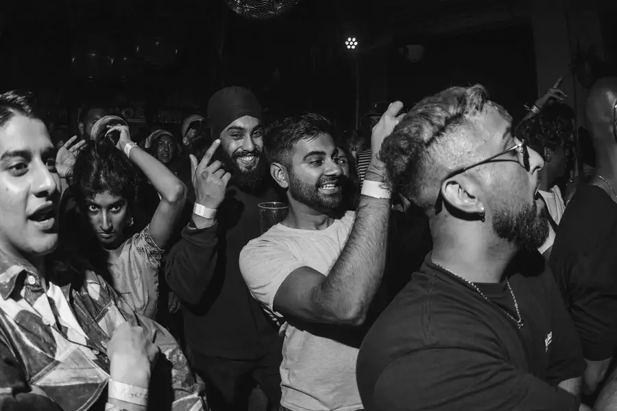 Black and White photo of group of people at a concert event