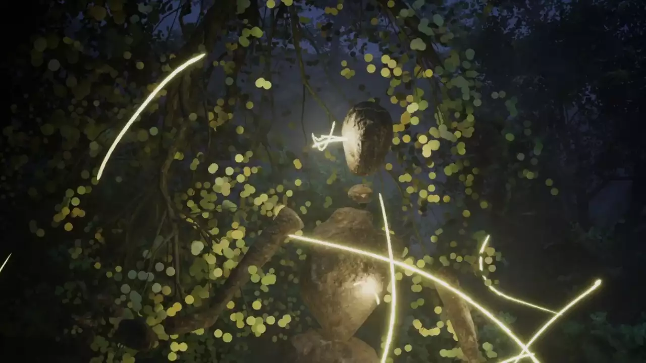 A digital humanoid figure made from stones is surrounded by fireflies in a forest