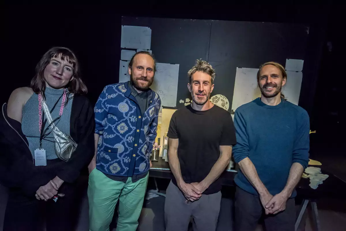 Four members of Studio Tonto smiling for a group photo in the South Warehouse during their takeover