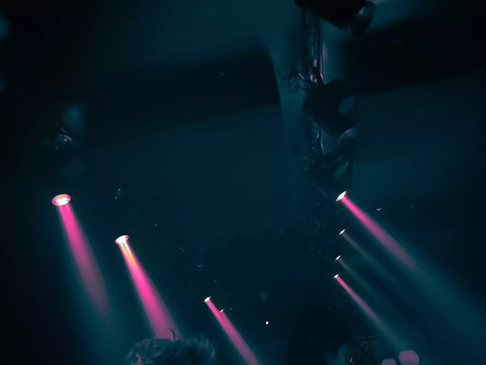 The ceiling of a club space with lights rigged
