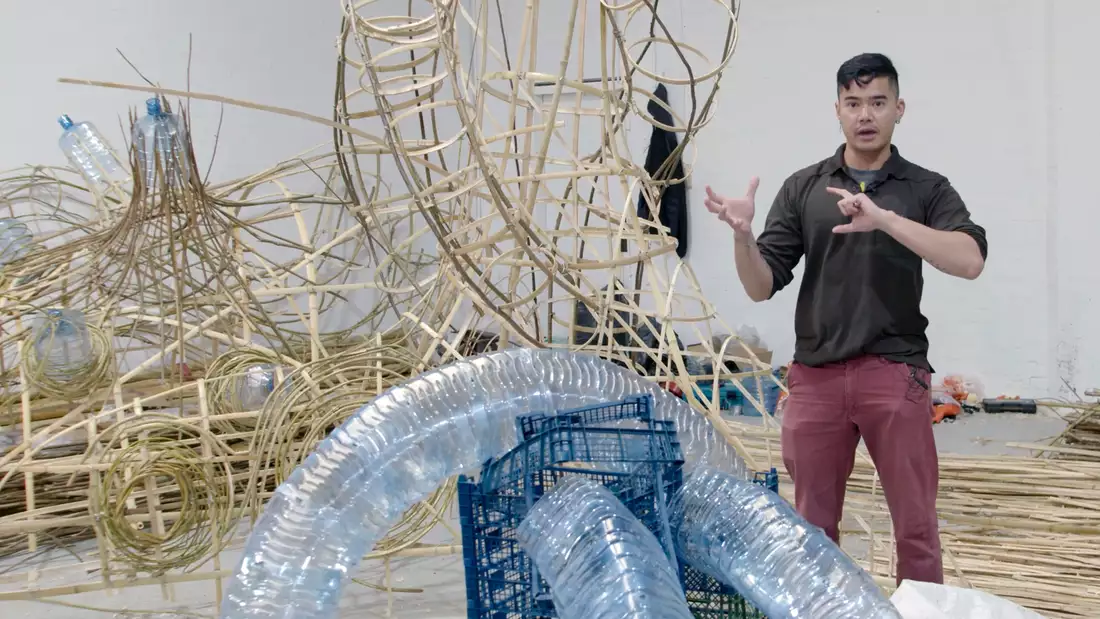 Artist Leeroy New with one of his sculptures