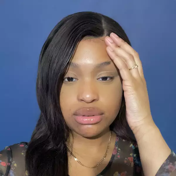 A photograph of Benedicte Tee looking straight at the camera