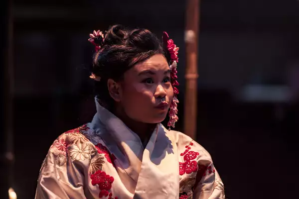 close-up photo of Mei Mac on stage