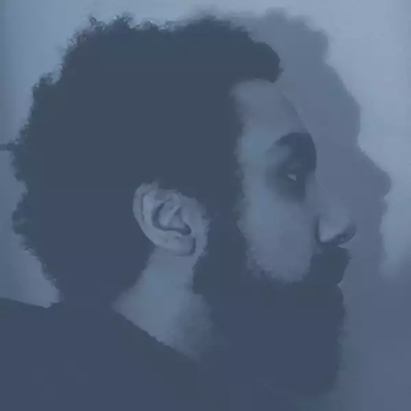 Side profile headshot of Algernon Cornelius with a dark blue filter