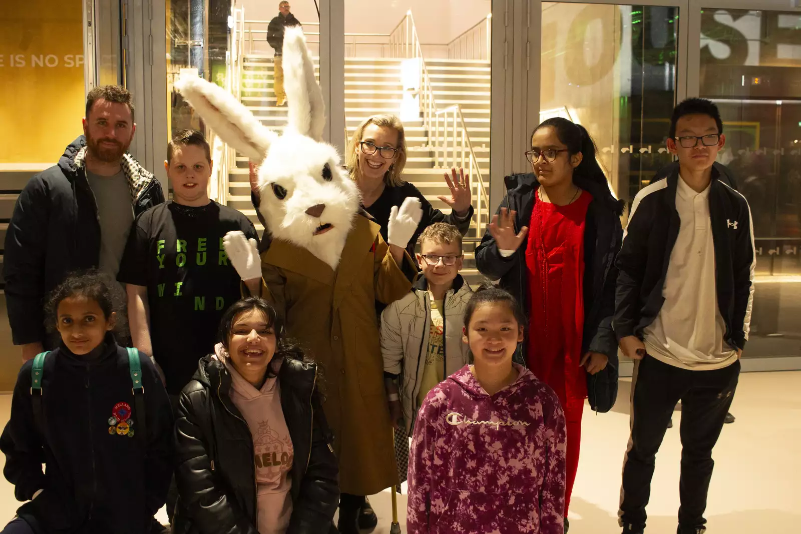 A group of children pose with a person dressed as a white rabbit, as part of Free Your Mind