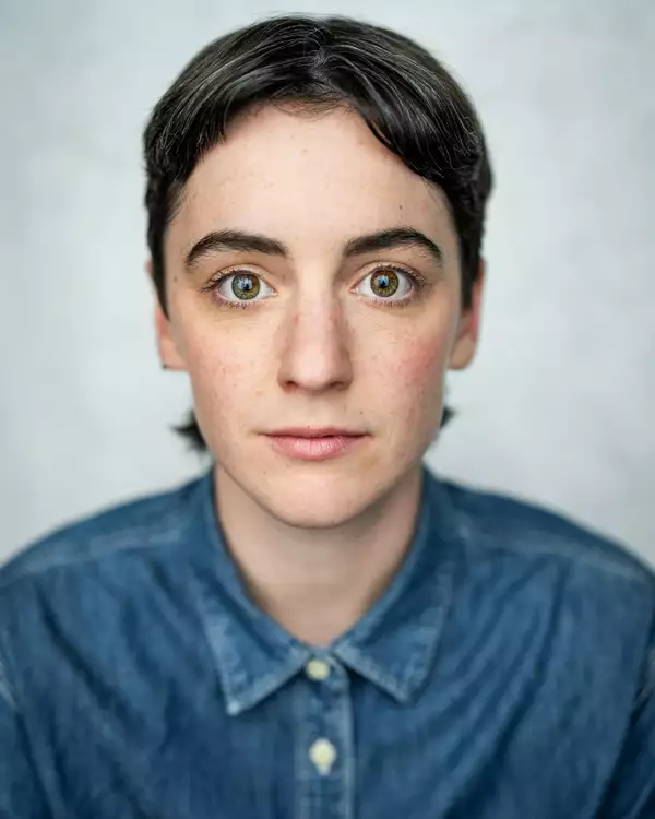 headshot of Annabel Baldwin wearing a blue denim shirt