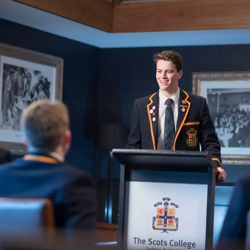 Student presenting at a lecturn