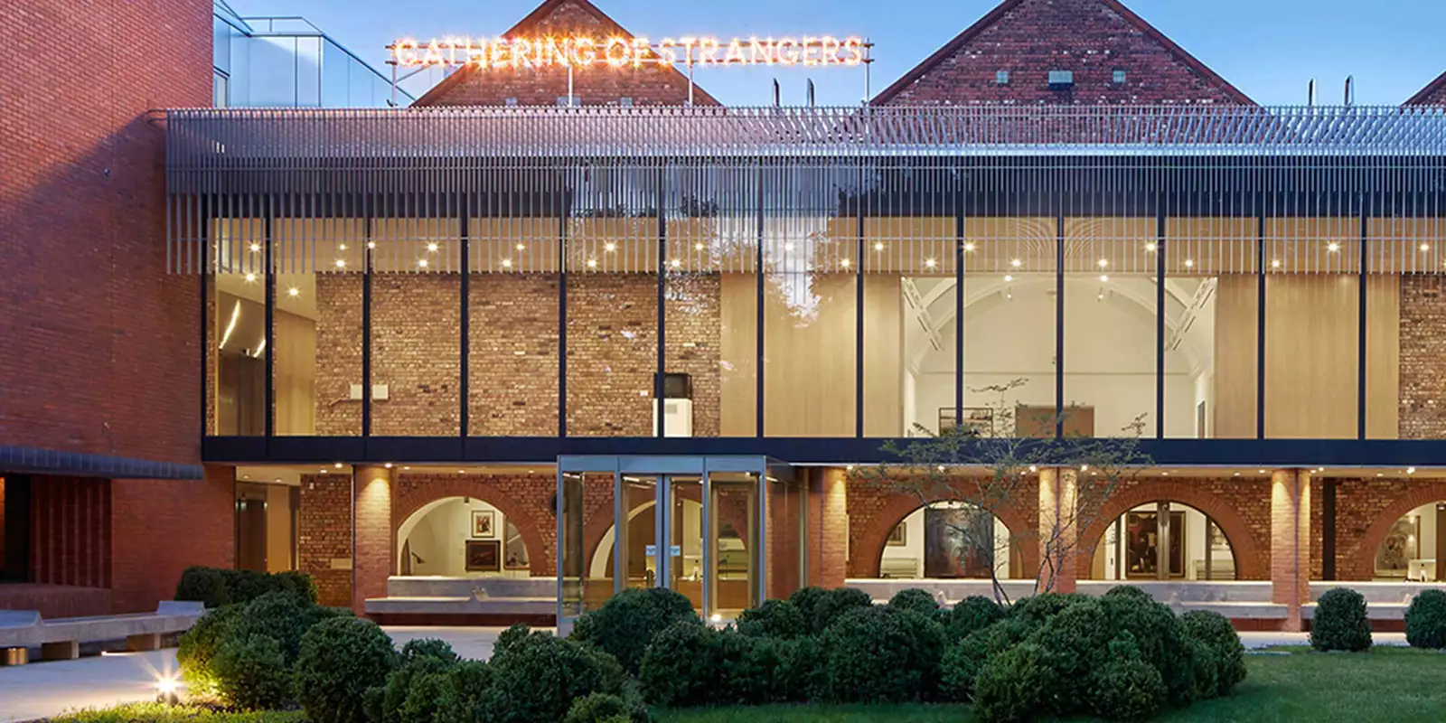 The exterior of the Whitworth Art Gallery photographed with gardens in the forefront