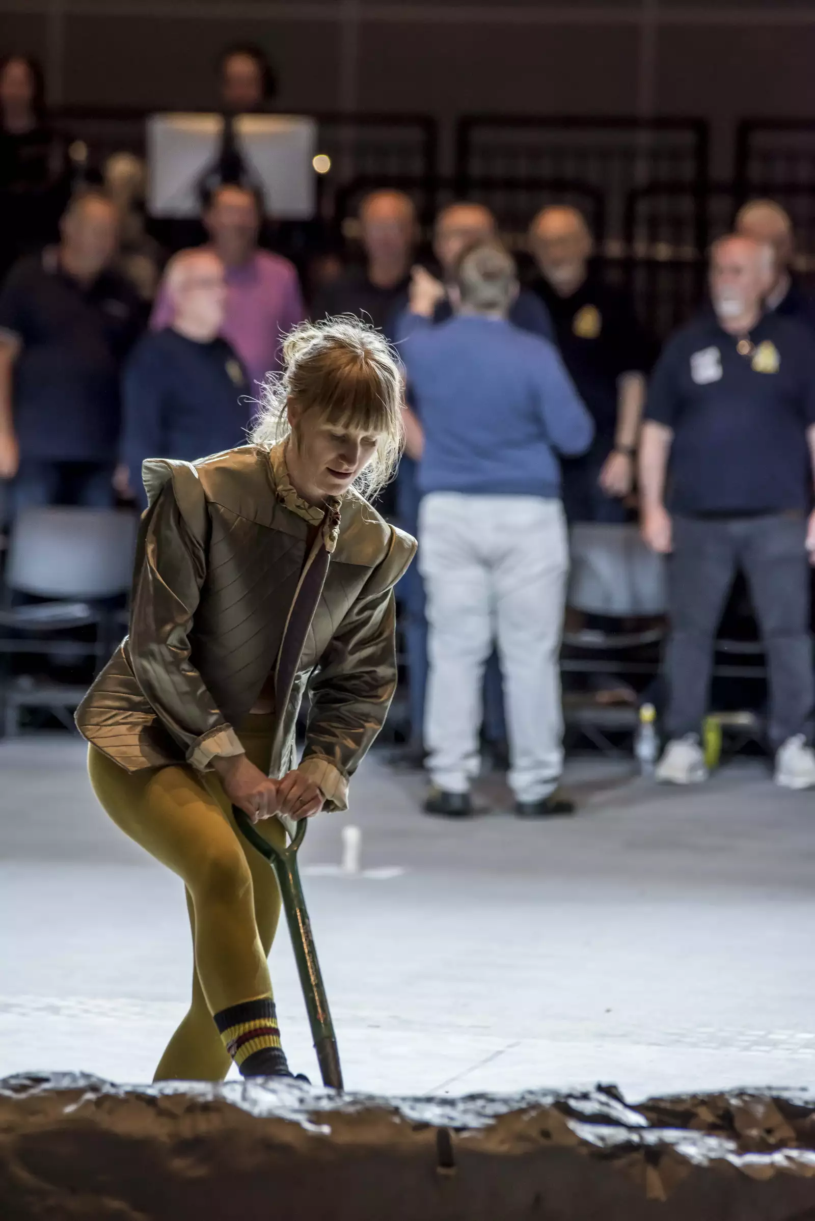 A performer digging into the clay installation during the June 2024 Artist Takeover