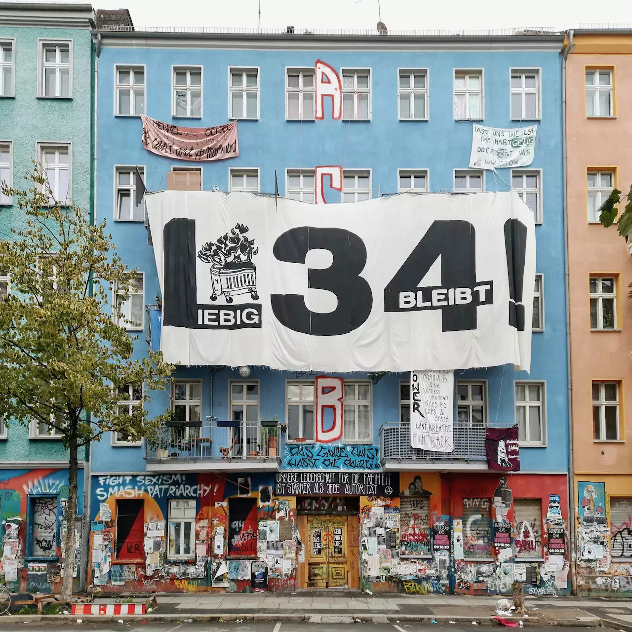 Photo of apartment block with a banner that reads L34!