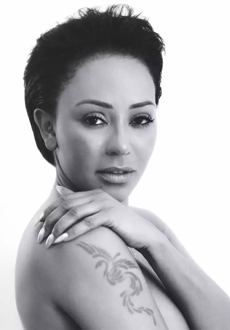 Mel B looking at the viewer over her right shoulder