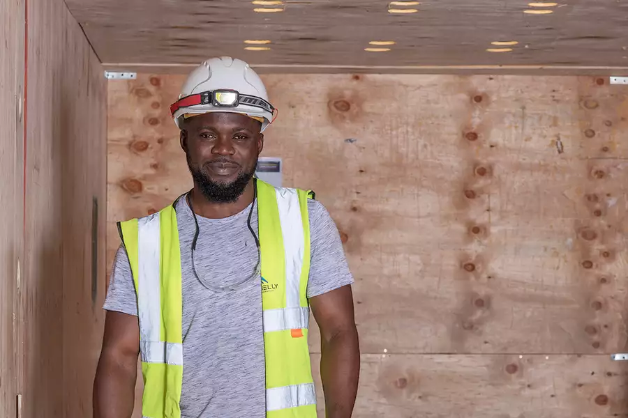 Photo of a worker wearing a helmet and hi vis