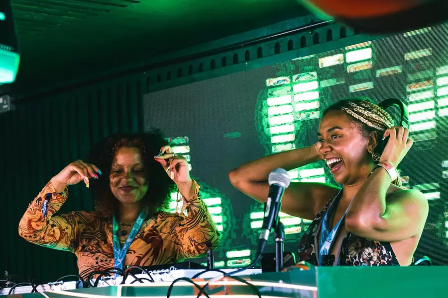 Photo of two DJs at the decks